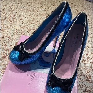 blue sparkly heels with black bow and shits detail